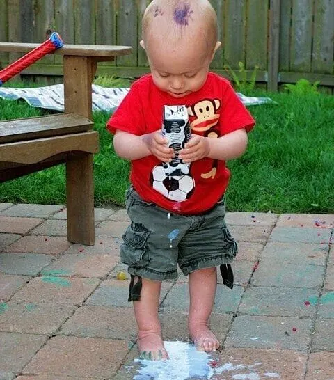 a little boy spilling milk