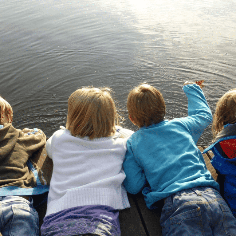 Kids looking at a pond