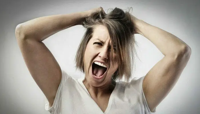 a mom yelling pulling her hair out