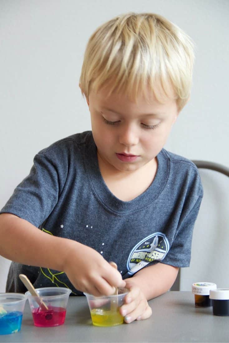 a young boy doing a science experiment